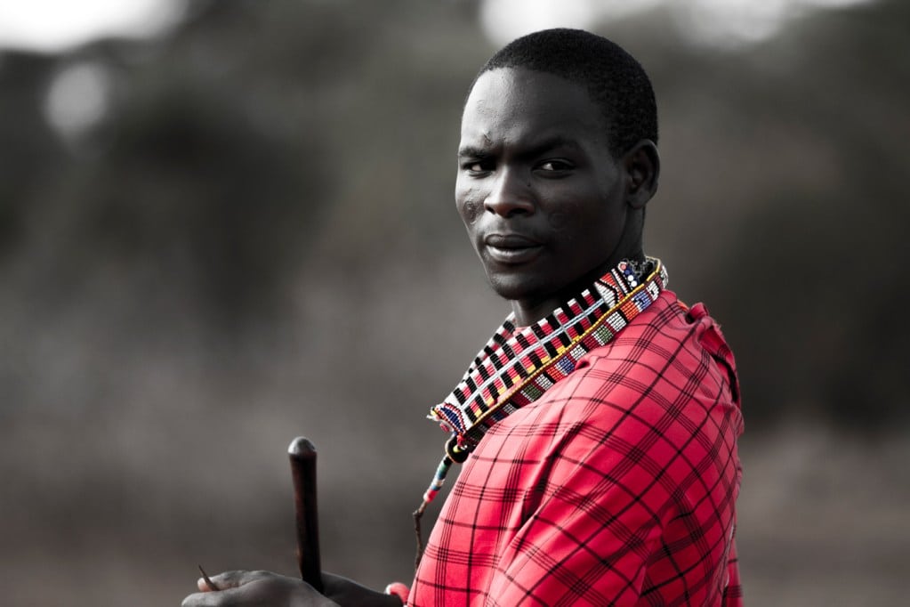 Male Maasai in traditional Shuka clothing with shepherd's crook