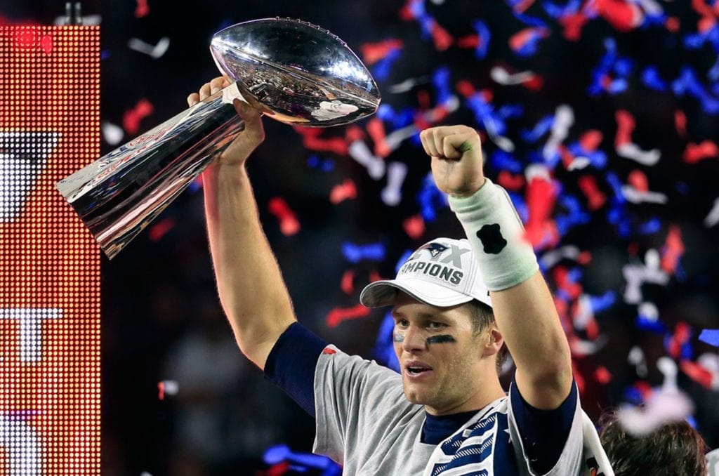 Tom Brady celebrates with the Vince Lombardi Trophy after defeating the Seattle Seahawks