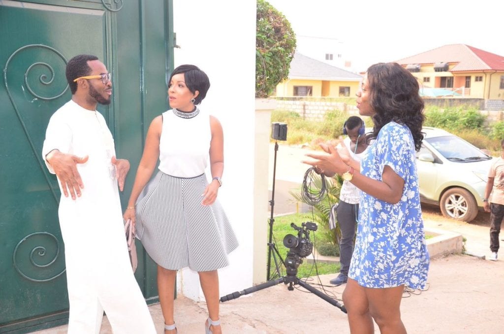 OC Ukeje (L) and Joselyn Dumas (C) in a scene from 'Potato Potahto' with Shirley Frimpong-Manso (R) directing